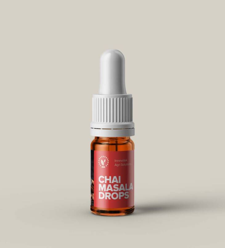 A bottle of Chai Masala Drops with aromatic Indian spices, perfect for enhancing tea flavor.