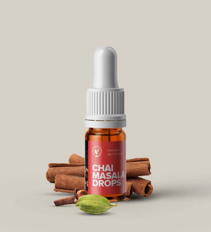 A bottle of Chai Masala Drops with aromatic Indian spices, perfect for enhancing tea flavor.